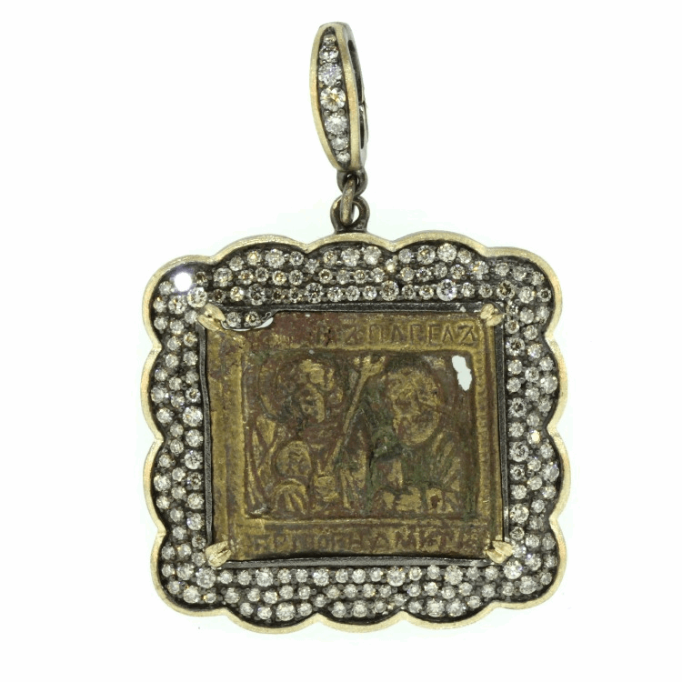 This remarkable 18th Century Russian Icon originally came from a three or four piece traveling bible. Traveling bibles were used for missionary work, military, or escaping the persecution from the authorities. During the 17th and 18th Century, master craftsman created these religious Icons by hand and sold them locally. This medal depicts Jesus, surrounded by divine light and supported by various Saints. The multicolored enamel is original. Chronicles and historical documents of the epoch give up hardly any information regarding the whereabouts of these work shops. 18th Century Russian Icon Bronze Pendant