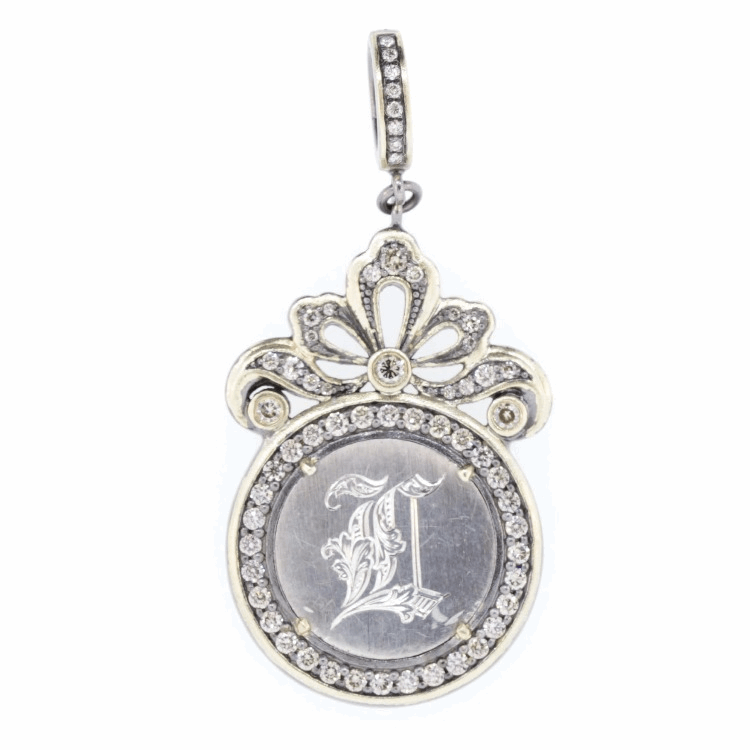 Love tokens reached their peak popularity during the Victorian era but are believed to have originated somewhere in Great Britain during the 1500’s. Often Love Tokens were exchanged between sweethearts as “tokens of love” or even marriage proposals. Love Tokens are generally defined as monetary coins from which one side (or sometimes both sides) have been smoothed down flat and engraved with names, phrases, monograms, and sometimes even pictorials.
Love Token Engraved With "L"