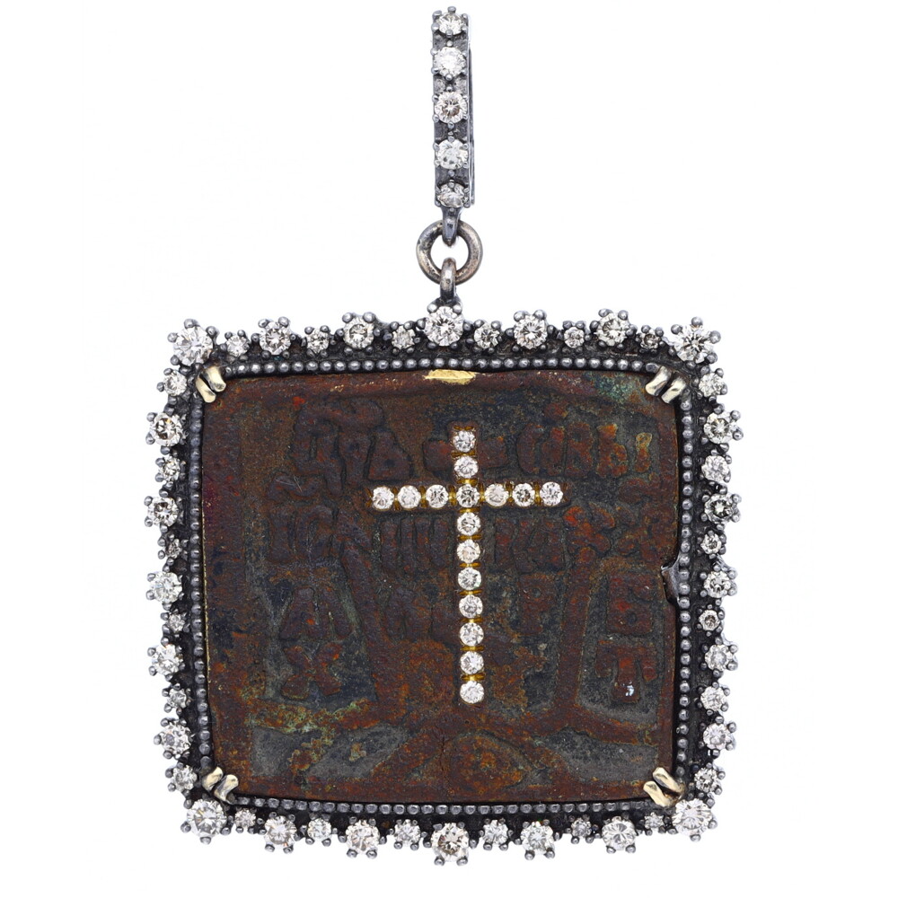 Icons tell a visual story to the faithful and help the faithful pray and meditate. Small metal Icons have a 1000-year-old history and were often called “Traveler's Icon”. Devoted individuals, soldiers and others would take them into battle or on their travels for protection. Traditionally made of bronze / brass, they were wearable and small (2 x 2.5 in). The soft brass originals were submitted to the constant wear of devoted fingers, recording the history of heavy prayer on these sacramentals. Besides spiritual protection through prayer, the icon provided physical protection as well.
69 CH DIA, 1.44 TW Russian Icon With Diamond Cross Inlay