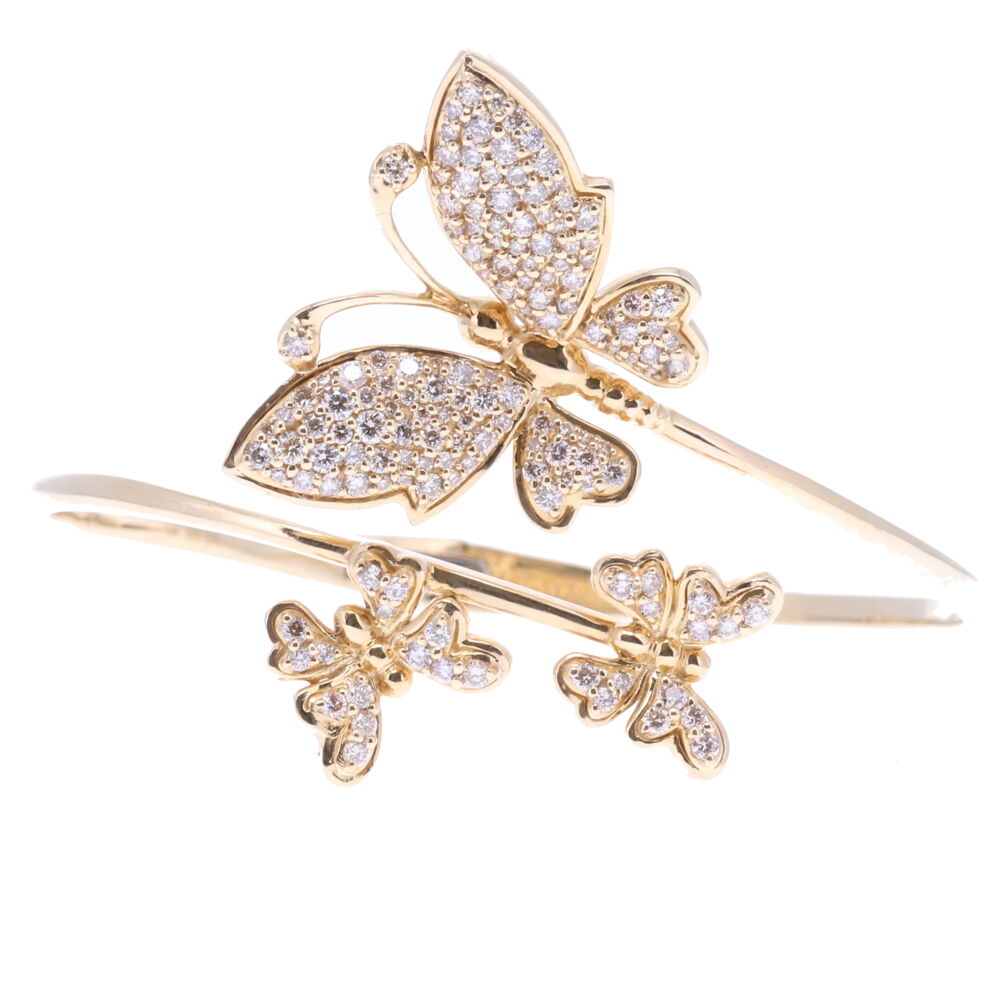 The butterfly is the symbol of resurrection and eternal life because they metamorphose from a caterpillar to a chrysalis and finally becomes a butterfly. Many believe that the soul left the body in the form of a butterfly. Aristotle named the butterfly 'psyche' which is the Greek word for Soul. This bracelet has a hinge opening 14k yellow gold 20.00g with Champagne diamonds 2.39tcw. Size 7 Butterfly Hinged Cuff Bracelet