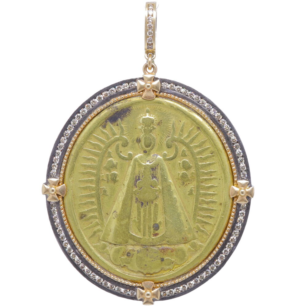 This bronze Spanish medal of Our Lady of Montserrat is set inside a unique channel set diamond bezel . This miraculous image of Our Lady and child is dressed in a crown with a cloak, plain in design is the most celebrated image in Europe. The Virgin of Montserrat is is the Patron saint of The Diocese of Catalonia.This medal is set in a 14k yellow gold 8.11g, champagne diamond 1.84tcw, and rhodium sterling bezel. Spanish Lady of Montserrat Mary Pendant