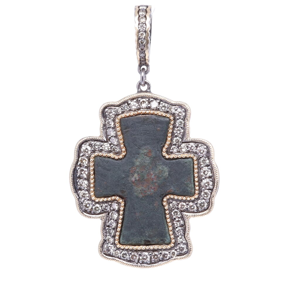 This original Byzantine Cross is defined by it's outwardly widening edges. The Cross has a natural green patina from oxidizing over time. The artifact is set in a 14k Yellow Gold 5.75g, Diamond 1.37 tcw, and Rhodium Sterling. The bale has a 4mm opening. Byzantine Artifact Cross Pendant