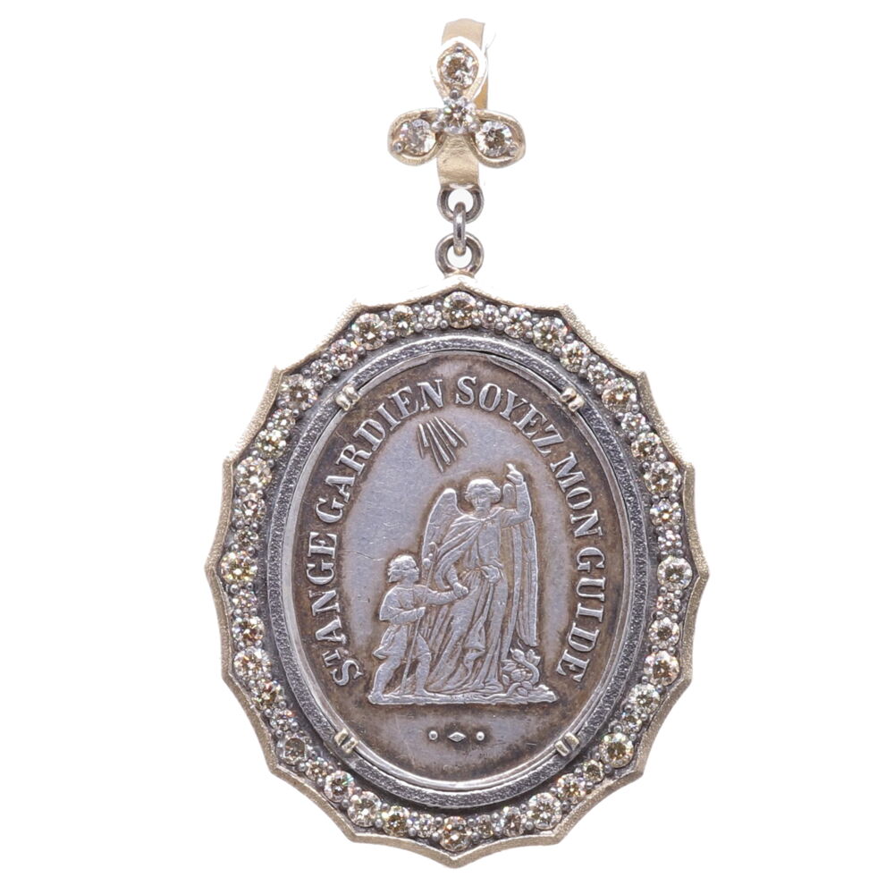 Belief in Guardian Angels can be traced throughout all antiquity. This original 1800's French medal represents your Guardian Angel that has been with you since you took your first breath and will be with you when you pass out of your body and return to the spiritual realms. This angel is unique to you and is there to guide you through your “spiritual journey” here on earth. The front of the medal translates to "Guardian Angel be my guide". Miraculous Mary is pictured on the back "Oh, Mary conceived without sin pray for us". She is a reminder in your faith in God and that you are never alone. This Angel is set inside a Diamond 1.44 tcw, 14k Yellow Gold 4.16g, and Rhodium sterling bezel. The bale has a 4mm opening. 1800's French Guardian Angel Pendant