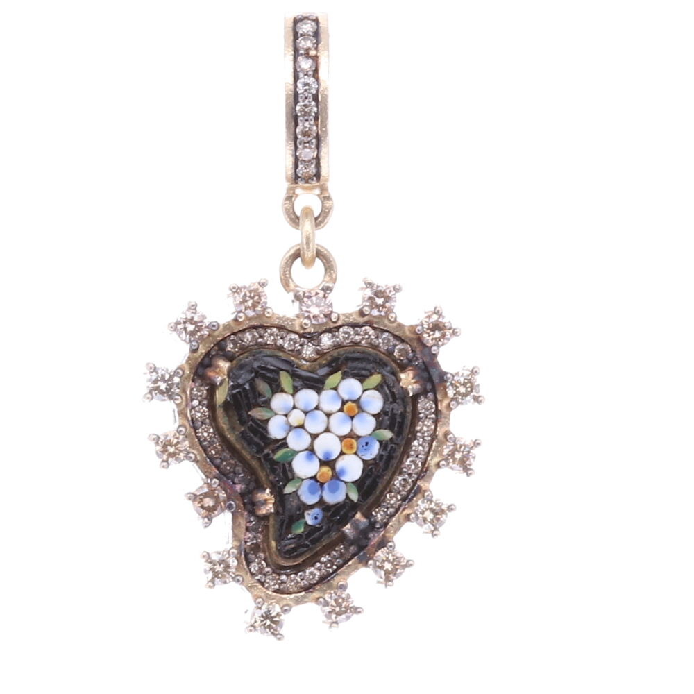 Wearing a heart symbolizes your declaration of love, compassion, and healing. Hearts are also used as a protection from evil. This original 17th-19th Century Italian Grand Tour micro mosaic heart is enclosed with a classic Cynthia Ann bezel. The mosaic flowers are a beautiful robin's egg blue color surrounded by black tiles. Folk tales say when a heart is swooped to one side it is absorbing only good energies. The bezel consists of 14k yellow gold 4.96g, rhodium sterling, and diamond 1.08 tcw. Black Antique Italian Micro Mosaic Heart Pendant with Blue Flowers