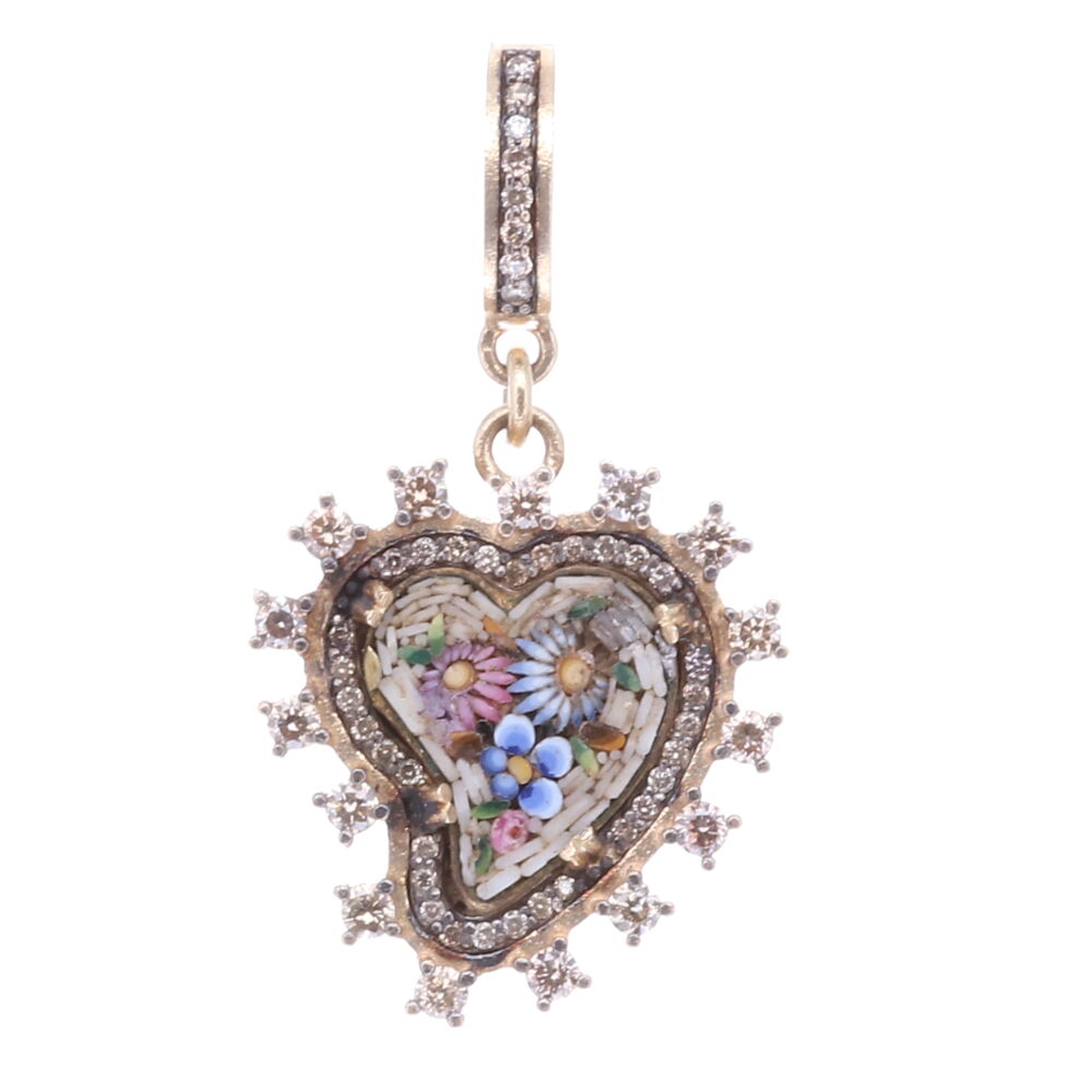 Wearing a heart symbolizes your declaration of love, compassion, and healing. Hearts are used as a protection from evil. This swooping left heart is an 17th-19th Century Italian Grand Tour micro mosaic. It's enclosed with a classic Cynthia Ann 14k yellow gold 4.96g, rhodium sterling and diamond 0.69 tcw bezel. The mosaic flowers are multicolored the background mosaics are taupe. Folk tales say when a heart is swooped to one side it is absorbing only good energies. Taupe Antique Italian Micro Mosaic Heart Pendant with Multi-Colored Flowers