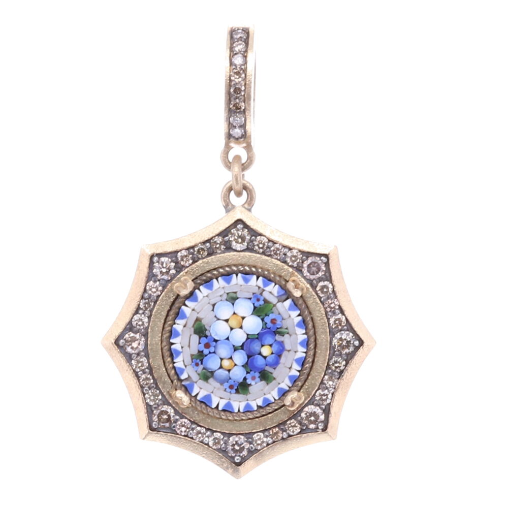 The original micro mosaic antique was handcrafted in Italy during the Grand Tour period 17th-19th Century. The blue colored mosaic pieces form a series of abstract flowers. Flowers and plants were created by God they express divine goodness, truth, and beauty. Micro mosaics or sometimes referred to as Micro Mosaics are handmade by artisans that use tiny pieces of glass (Tesserae) or enamel like pieces to construct a small figurative image. This mosaic is set in a classic Cynthia Ann 14k Yellow Gold 3.91g, Diamond 0.57 tcw, and rhodium sterling bezel. Blue Floral Authentic Italian Micro Mosaic Pendant/Charm