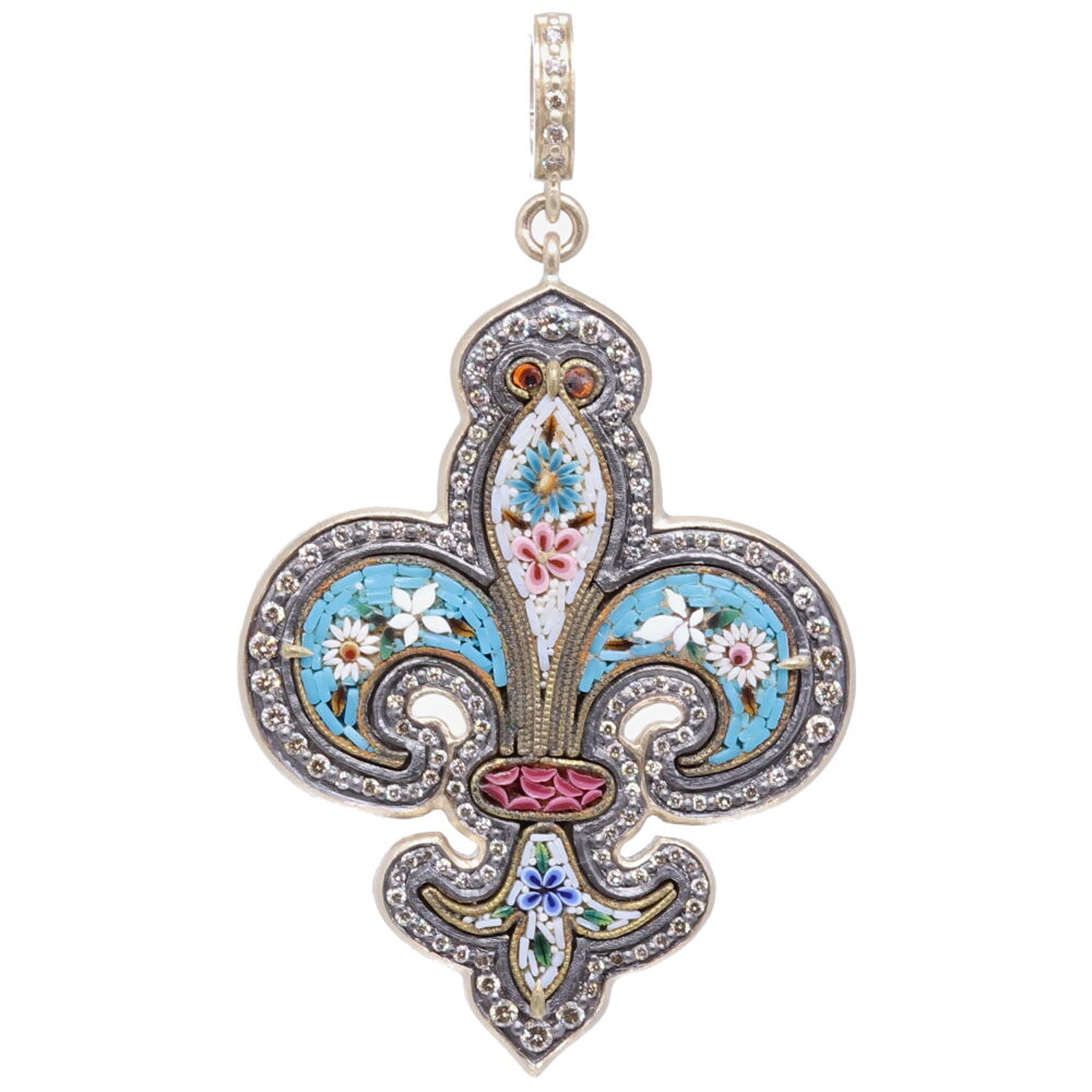 This original Italian Micro Mosaic Fleur De Lis from the Grand Tour period 1680-1880. During that time students were traveling to Europe to further enrich their classical studies. As they traveled throughout Europe they brought home small piece from their travels. This original Grand Tour micro mosaic is set in a Cynthia Ann 14k yellow gold 6.18g, champagne diamond 1.20 tcw, and rhodium sterling bezel. Fleur De Lis Grand Tour Micro Mosaic Pendant