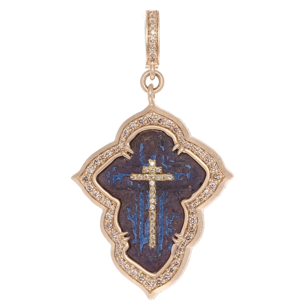 <div><span style="font-size: 16.8px; position: initial; margin: initial;">This gorgeous antique Orthodox Cross still features its original royal blue enamel. Cynthia Ann has artfully enhanced it using her fitted bezel which is crafted with three quarters of a carat of champagne diamonds set in 10.73g of 14k yellow gold. All of this of course hangs from her signature openable bale. </span></div><span style="font-size: 16.8px; position: initial; margin: initial;"><div><span style="font-size: 16.8px; position: initial; margin: initial;"><br></span></div>The Orthodox Cross, Byzantine or Russian Orthodox Cross is a variation of the Christian Cross. It’s found in every Eastern Orthodox Church and Catholic Church of the Byzantine Rite. One version of the Orthodox Cross has a long vertical beam crossed about two thirds of the way up by a horizontal beam that represents Pontius Pilates’s inscription “Jesus the Nazarene, King of the Jews” and a lower beam representing the foot rest upon which our Lord’s feet were nailed. The lower beam is slanting up toward heaven. Many Orthodox crosses have trefoils.</span> Small Orthodox Cross Pendant 14k Gold with Diamonds and Blue Enamel