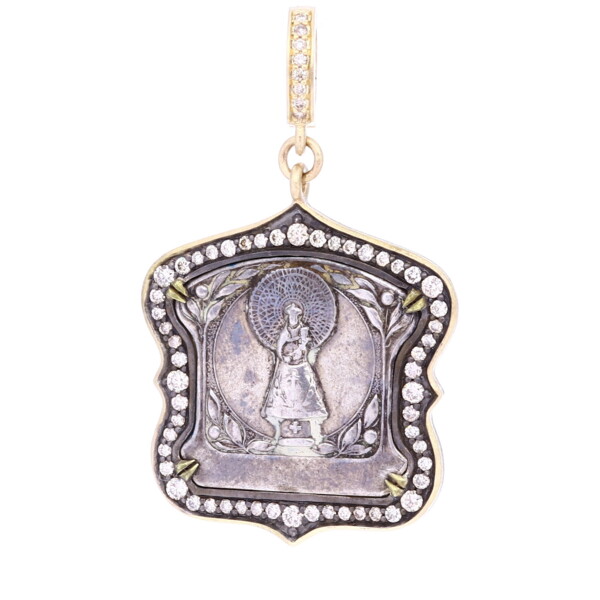 Closeup photo of Antique Virgin Mary Medal Pendant