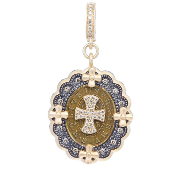 Closeup photo of Antique St Benedict Medal w/ Cross Decal Pendant