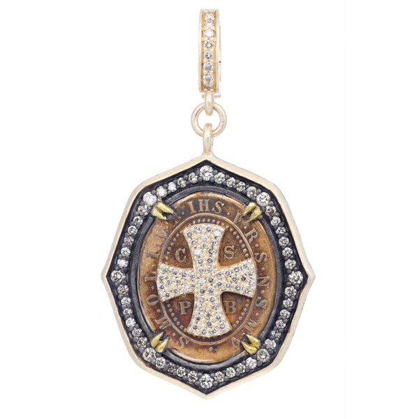 Closeup photo of Antique St Benedict Medal w/ Cross Decal