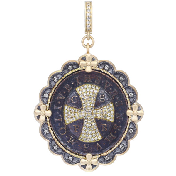 Closeup photo of Antique St Benedict Medal Pendant