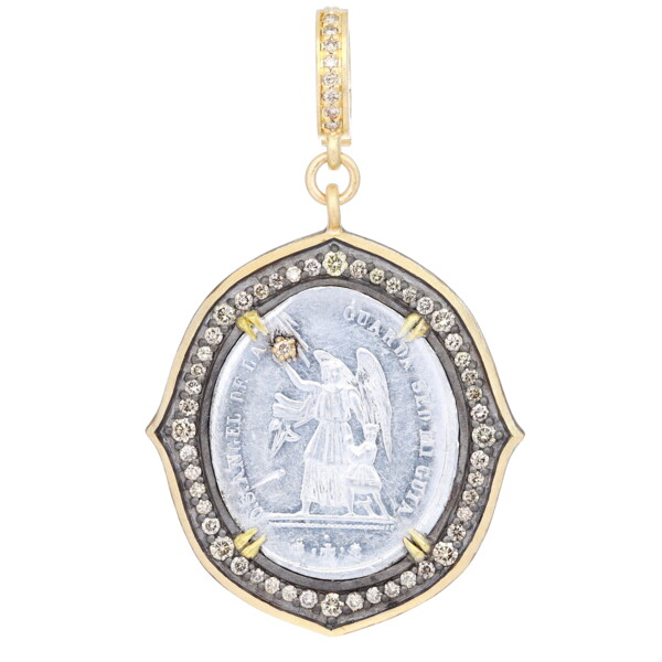 Closeup photo of Antique Guardian Angel Medal