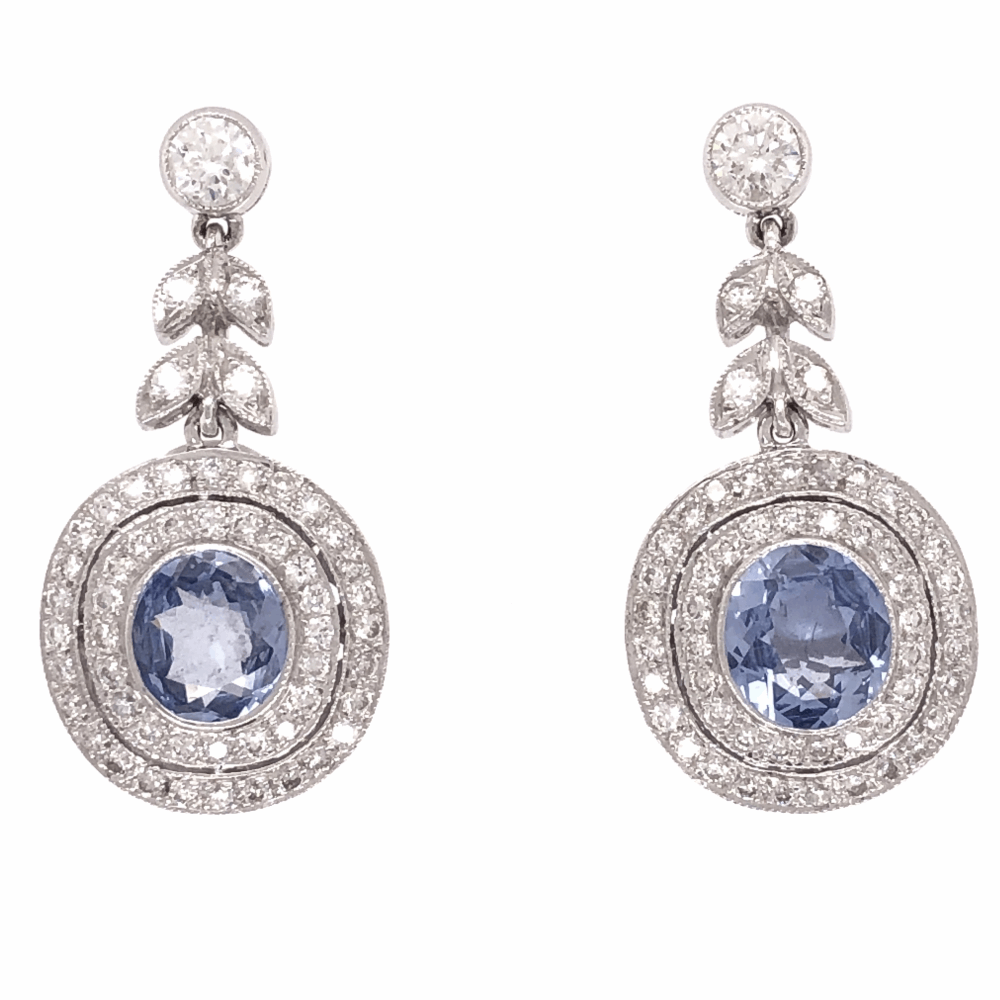 Timeless design is perfectly defined in these earrings. Understated and extremely elegant, white diamonds surround gorgeous Cornflower Blue sapphires. You'll be getting compliments all night from anyone who lays eyes on these gorgeous earrings. Earring height measures 1.1"<div>Sapphires: 2.08tcw<br><div><div>Diamonds: 1.05tcw</div></div></div> Filligree and Milgrain earrings 18K Gold with Sapphire and Diamond