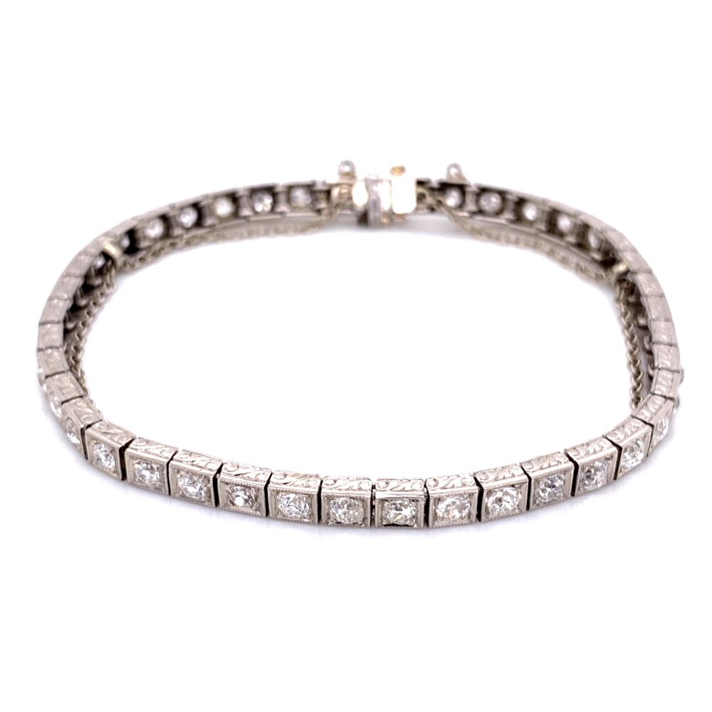 Length 7in.<div style="position: initial; margin: initial;"><span style="font-size: 16.8px; position: initial; margin: initial;"><a href="https://youtu.be/E5V_evTQ020" title="https://youtu.be/E5V_evTQ020" style="text-decoration: none;">https://youtu.be/E5V_evTQ020</a></span><br style="position: initial; margin: initial;"></div> Platinum Art Deco Engraved Line Bracelet 4.25tcw OEC diamonds, 7"
