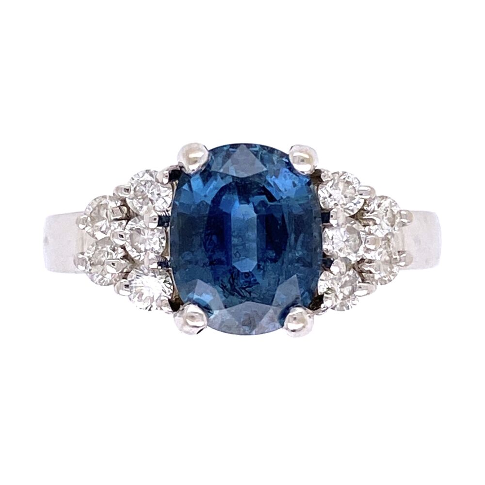 I love this steel blue sapphire color... this is not the typical blue, but more a steely gray undertone to the bright blue. This color is what likely comes from Australian Sapphire mines although this stone has no lab report or official origin. If you are looking for a little different blue that has the gray undertones, then this is the ring for you! 14K White Gold 2.00ct Oval Blue Sapphire & .50tcw Diamond Ring 5.2g, s6