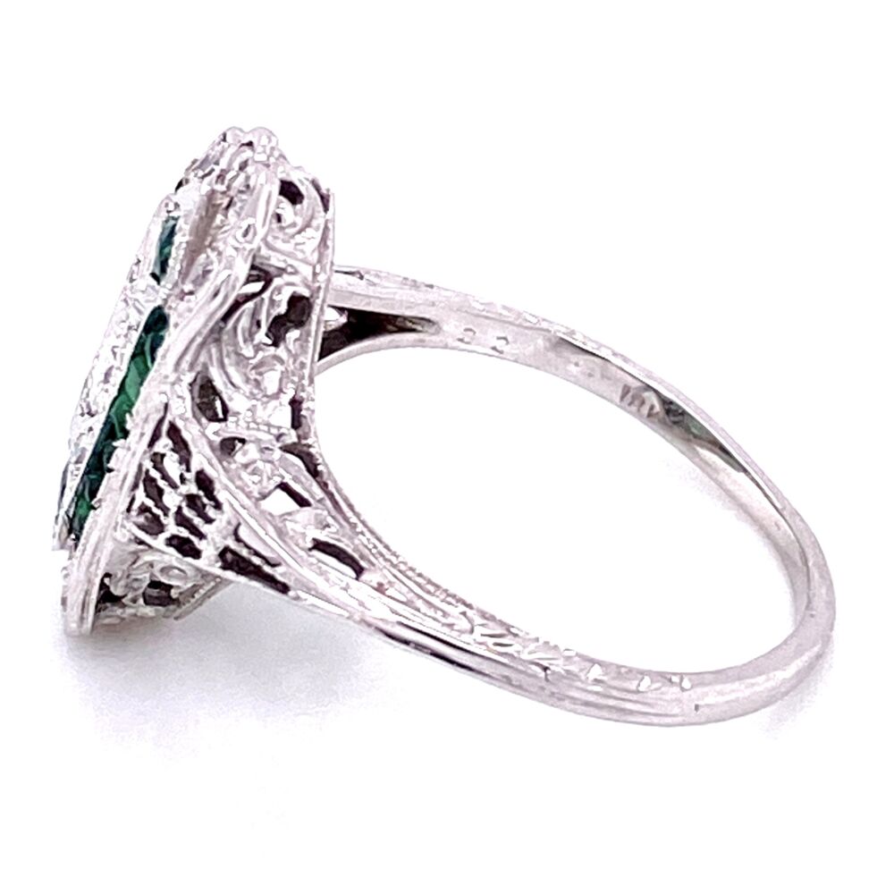 This sweet art deco ring is thin and low profile! The emeralds accenting the diamonds give it just the amount of bling it needs and we love the low profile design making this ring very easy to wear!<div style="position: initial; margin: initial;"><span style="font-size: 16.8px; position: initial; margin: initial;"><a href="https://youtu.be/1Ou4sP5OZ9s" title="https://youtu.be/1Ou4sP5OZ9s" style="text-decoration: none;">https://youtu.be/1Ou4sP5OZ9s</a></span><br style="position: initial; margin: initial;"></div> 18K WG Art Deco Filigree .22tcw Diamond & Emerald Ring, s7