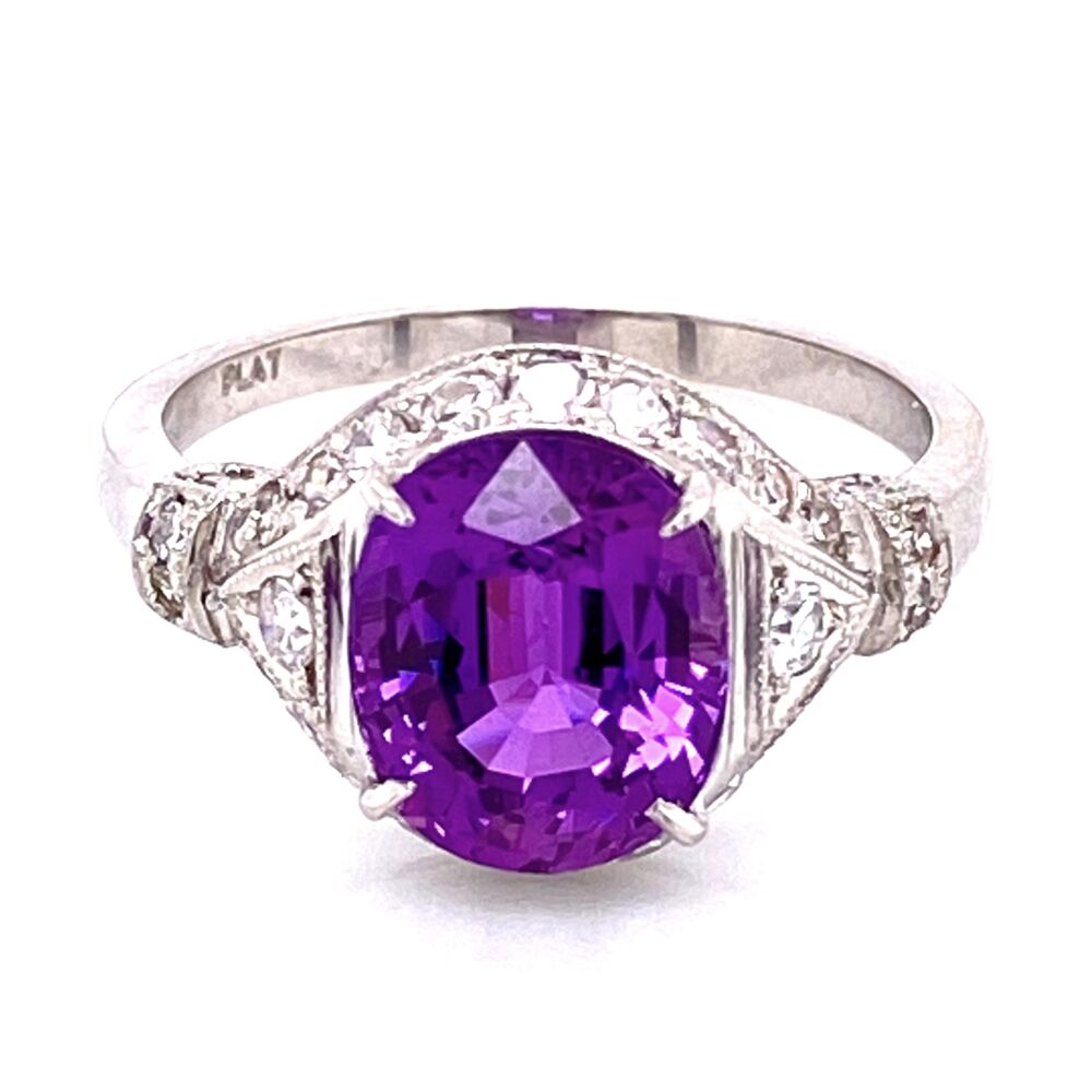 This amazing Purple Sapphire is a natural corundum sapphire and has a lab report from GIA #1206642999. The ring is an Art Deco original Platinum Ring with old cut diamonds, bladed under-gallery and milgrain finish. As amazing the ring is, it's the mesmerizing color of the 3.5ct Purple Sapphire that truly captivates the senses. If you're looking for a purple sapphire, this color is truly amazing and will not disappoint! Platinum 3.55ct Oval Purple Sapphire & .45tcw diamond Ring GIA