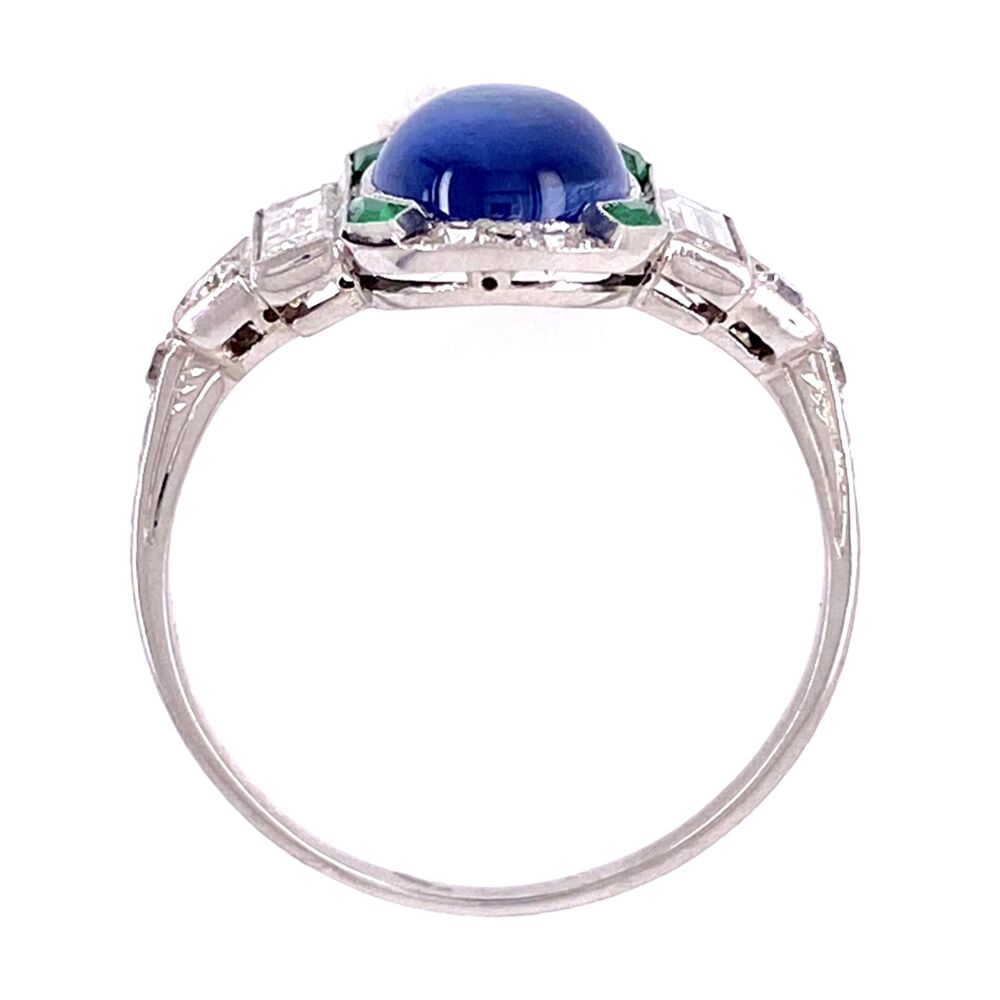 We love this ring because of the color combination of green & blues and the fact that it sits so low on the finger but still packs the bling! The center cabochon blue sapphire weighs about 1.45ct, the 4 custome cut emeralds weigh about .09tcw and baguette & round diamonds weigh approx. .60tcw. Platinum Art Deco Cab Sapphire, Emerald & Diamond Ring 3.8g, s7.5