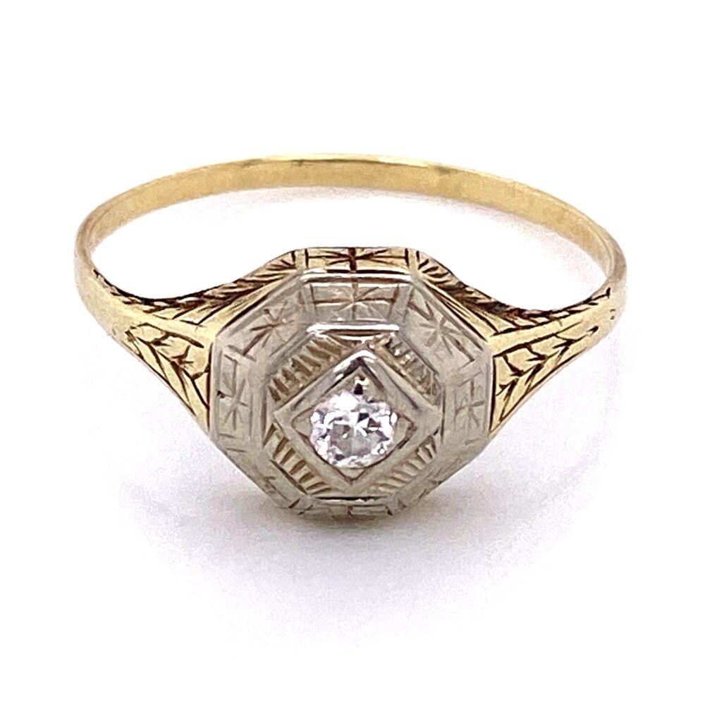 There is a modern diamond approx .07ct Circa 1950, while the mounting is earlier c1910. Platinum on Gold late Edwardian Diamond Ring with Engraving, 2.8g, s10