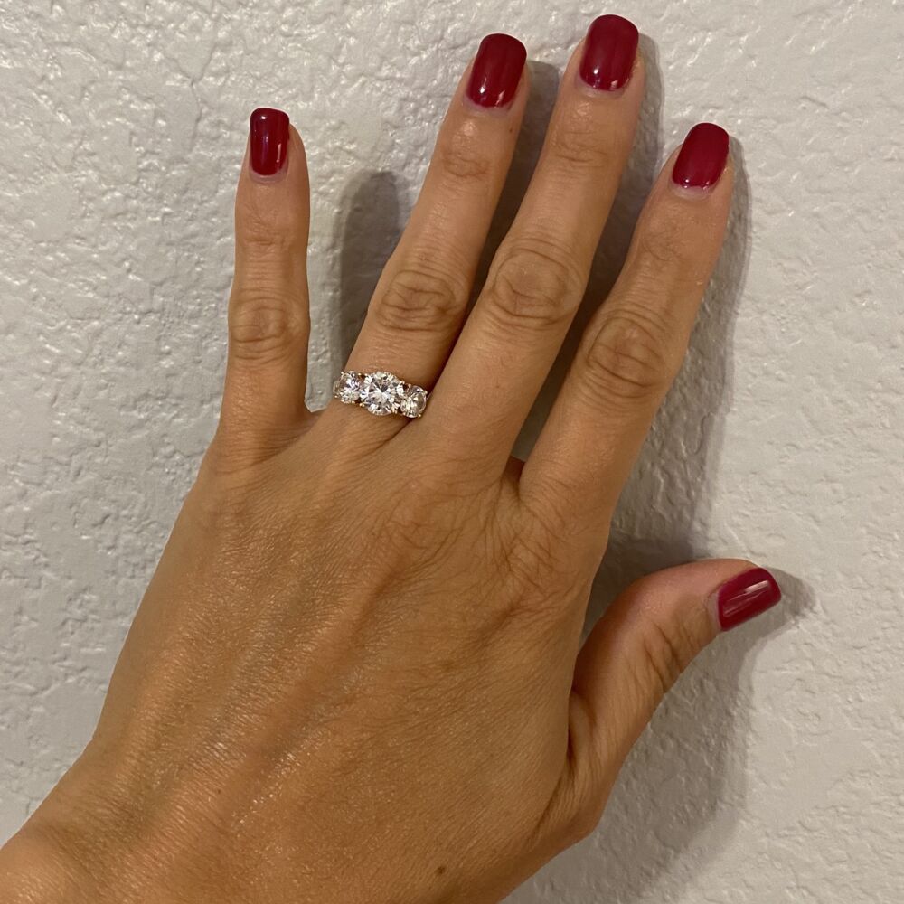 Get the Bling for little cash! The ring is real 14K yellow gold but has cubic zirconia stones otherwise known as CZ's! CZ's are an excellent diamond simulant, so this could also be a great travel ring! 14K YG Classic 3 Stone 4 prong CZ Cubic Zirconia Ring, 3.3g, s