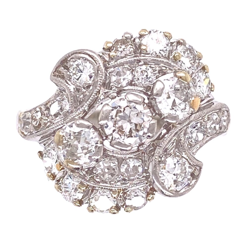 This ring is a classic 1950's Spray design with old cut round diamond constructed in high quality 950 Platinum. The diamonds weigh approx. 1.55tcw Platinum 1950's Spray 1.55tcw Diamond Ring 6.9g, s5.5