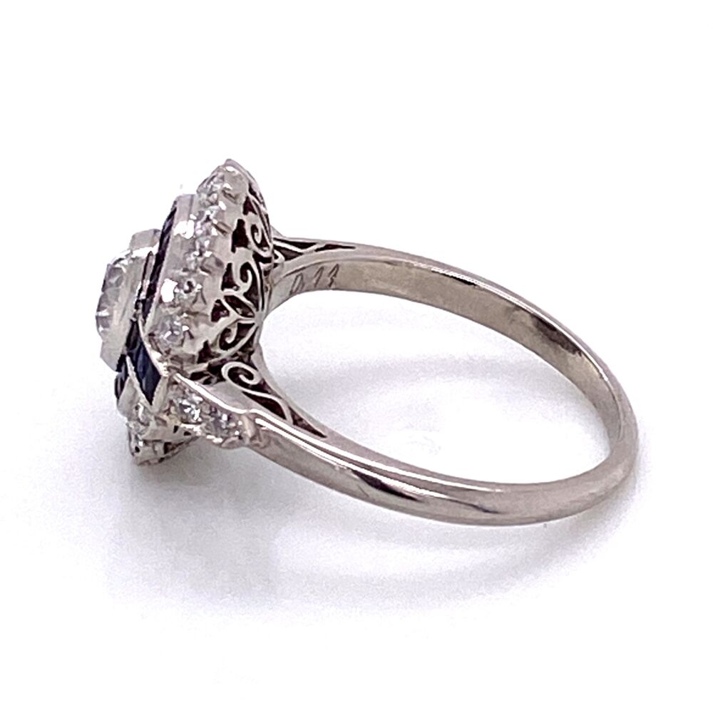 This ring is newer, so it is Art Deco Style. The design is definitely Art Deco with the geometric design, the handmade under gallery and amazing attention to detail. The center old European cut diamond measures to .44ct, the sapphires are approx. .70tcw and the side old European cut diamonds weigh approx .46tcw. Platinum Art Deco .44ct Old European Cut Diamond & Sapphire Ring