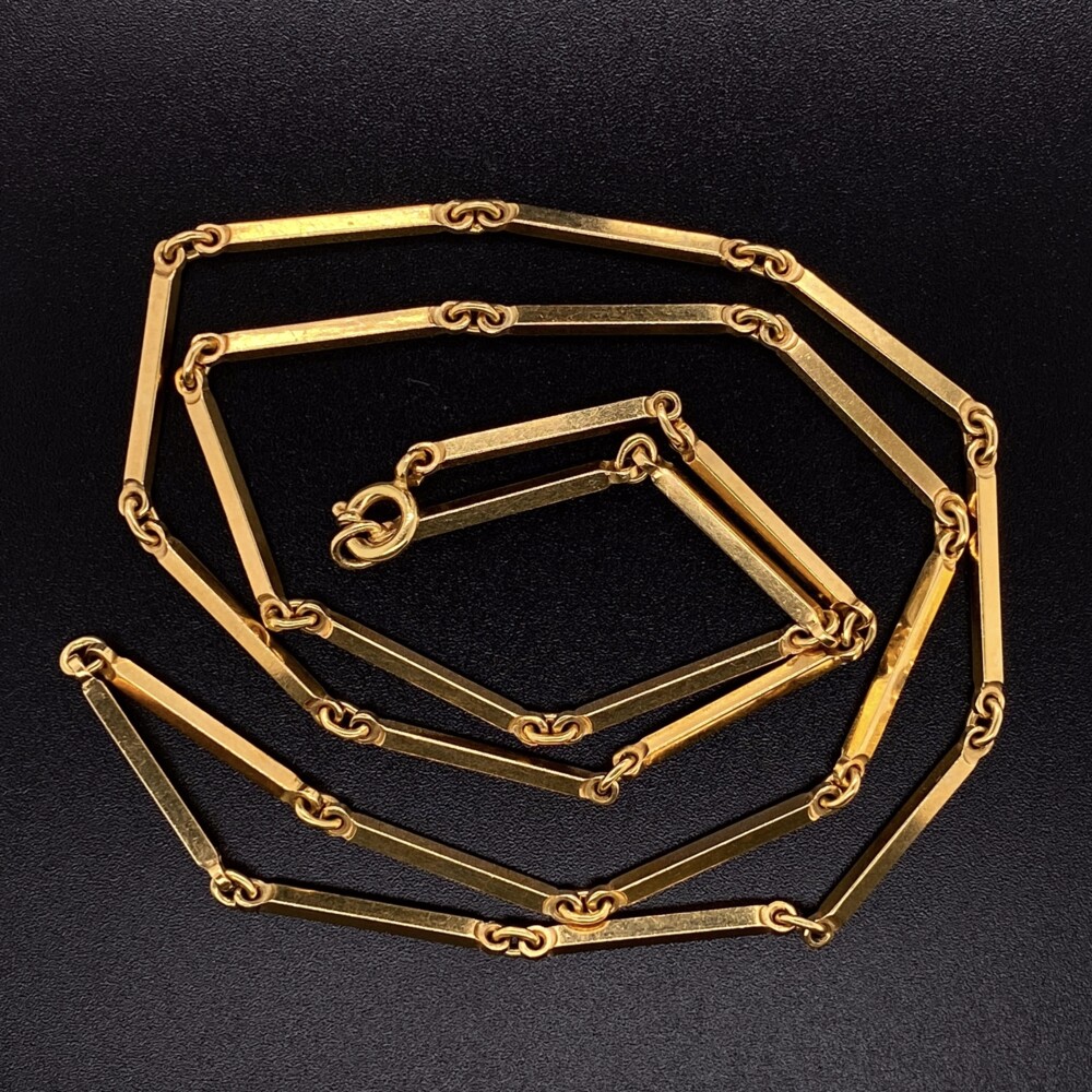 18K Gold, but looks to have a deeper yellow wash of 24Kish. These retro link chains don't come on the second hand market that often so they move quick!<div style="position: initial; margin: initial;"><a href="https://youtu.be/CYVKmCGkJPo" title="https://youtu.be/CYVKmCGkJPo" style="text-decoration: none;">https://youtu.be/CYVKmCGkJPo</a><br style="position: initial; margin: initial;"></div> 18K Yellow Gold Bar Link Chain with Spring Ring Clasp 19.2g, 21"