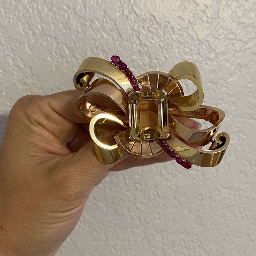 This beautiful brooch is retro from the 1940's constructed of fine 14K green & rose gold and has large emerald citrine quartz weighing approx. 49cts. There are 10 cabochon red rubies accent stones weighing approx. 1.00tcw. 14K Retro Green & Rose Gold Brooch with 49ct Citrine & Rubies 41.6g