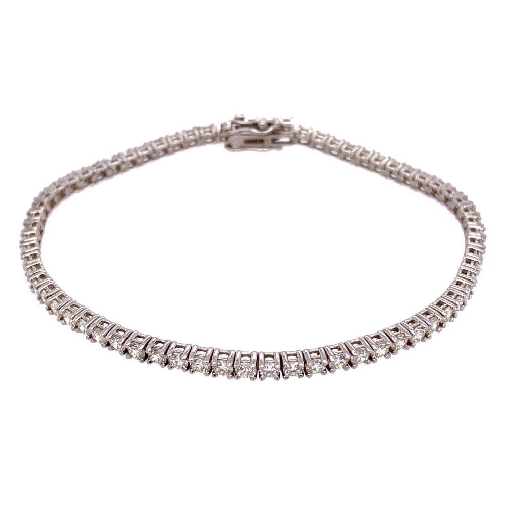 Beautiful & Classic, this straight line four prong diamond tennis bracelet has 67 natural round brilliant diamonds weighing 3.76tcw. 7.4g gross weight and 7" long<div style="position: initial; margin: initial;"><span style="font-size: 16.8px; position: initial; margin: initial;"><a href="https://youtu.be/laqrgF7GasU" title="https://youtu.be/laqrgF7GasU" style="text-decoration: none;">https://youtu.be/laqrgF7GasU</a></span><br style="position: initial; margin: initial;"></div> 14K WG Straight Line Diamond Tennis Bracelet 3.76tcw, 7"