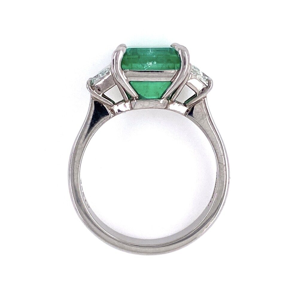 The center 3.55ct green emerald is an almost square emerald cut set in a custom platinum mounting with a beautifully matched pair of trapezoid diamonds weighing approx. .66tcw<div style="position: initial; margin: initial;"><span style="font-size: 16.8px; position: initial; margin: initial;"><a href="https://youtu.be/b0DD7F3uuWQ" title="https://youtu.be/b0DD7F3uuWQ" style="text-decoration: none;">https://youtu.be/b0DD7F3uuWQ</a></span><br style="position: initial; margin: initial;"></div> Platinum 3.55ct Emerald & 2 Trapezoid Diamonds .66tcw Ring, s6.5