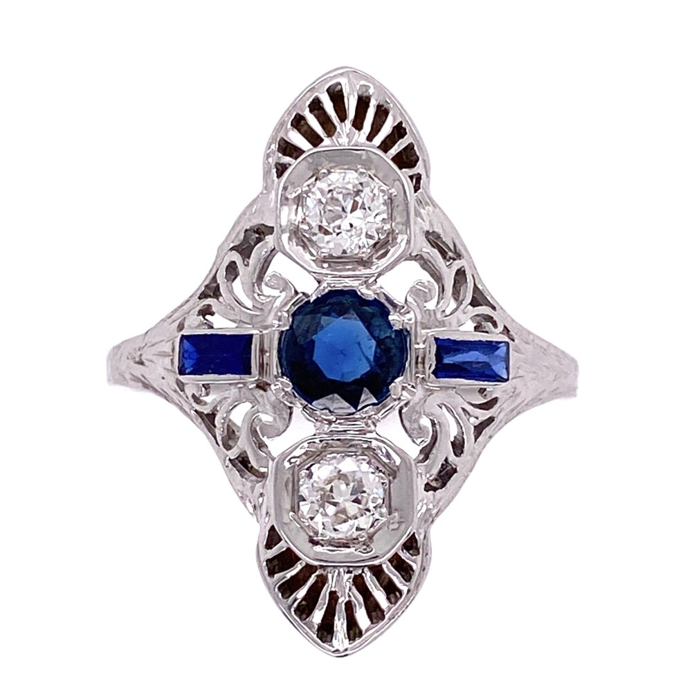 This original art deco ring has a center blue stone and two side synthetic sapphires along with 2 old european cut round weighing approx. .30tcw.<div style="position: initial; margin: initial;"><span style="font-size: 16.8px; position: initial; margin: initial;"><a href="https://youtu.be/_37seZ9bhMI" title="https://youtu.be/_37seZ9bhMI" style="text-decoration: none;">https://youtu.be/_37seZ9bhMI</a></span><br style="position: initial; margin: initial;"></div> 18K WG Art Deco Navette .30tcw Diamond Ring with Blue Stones 2.9g