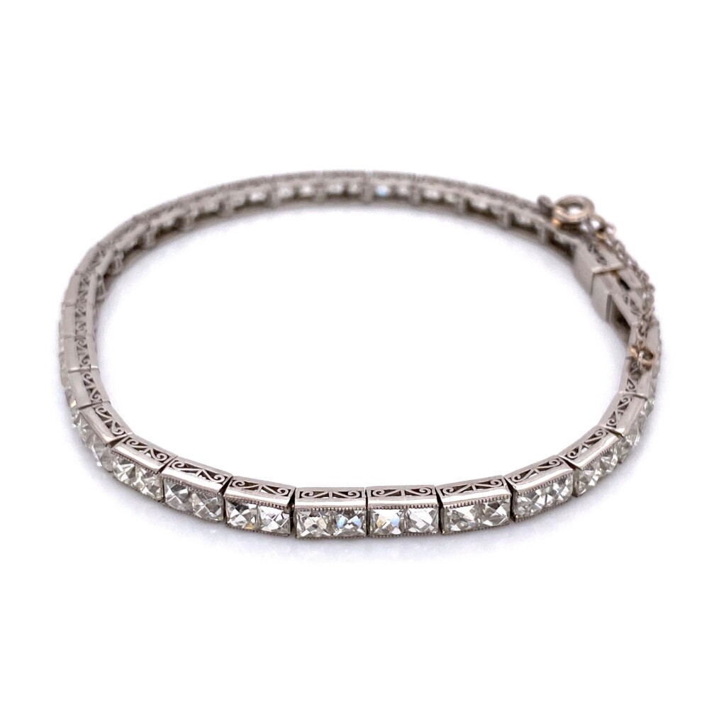 61 French Cut (sometimes referred to as Caré cut) natural diamonds weigh 12.90tcw. This is a rare bracelet and a rare layout of diamonds making it crazy cool!<div style="position: initial; margin: initial;"><span style="font-size: 16.8px; position: initial; margin: initial;"><a href="https://youtu.be/ltezsJpS56Q" title="https://youtu.be/ltezsJpS56Q" style="text-decoration: none;">https://youtu.be/ltezsJpS56Q</a></span><br style="position: initial; margin: initial;"></div> Handmade Platinum French Cut Diamond Bracelet 12.9tcw, 7"