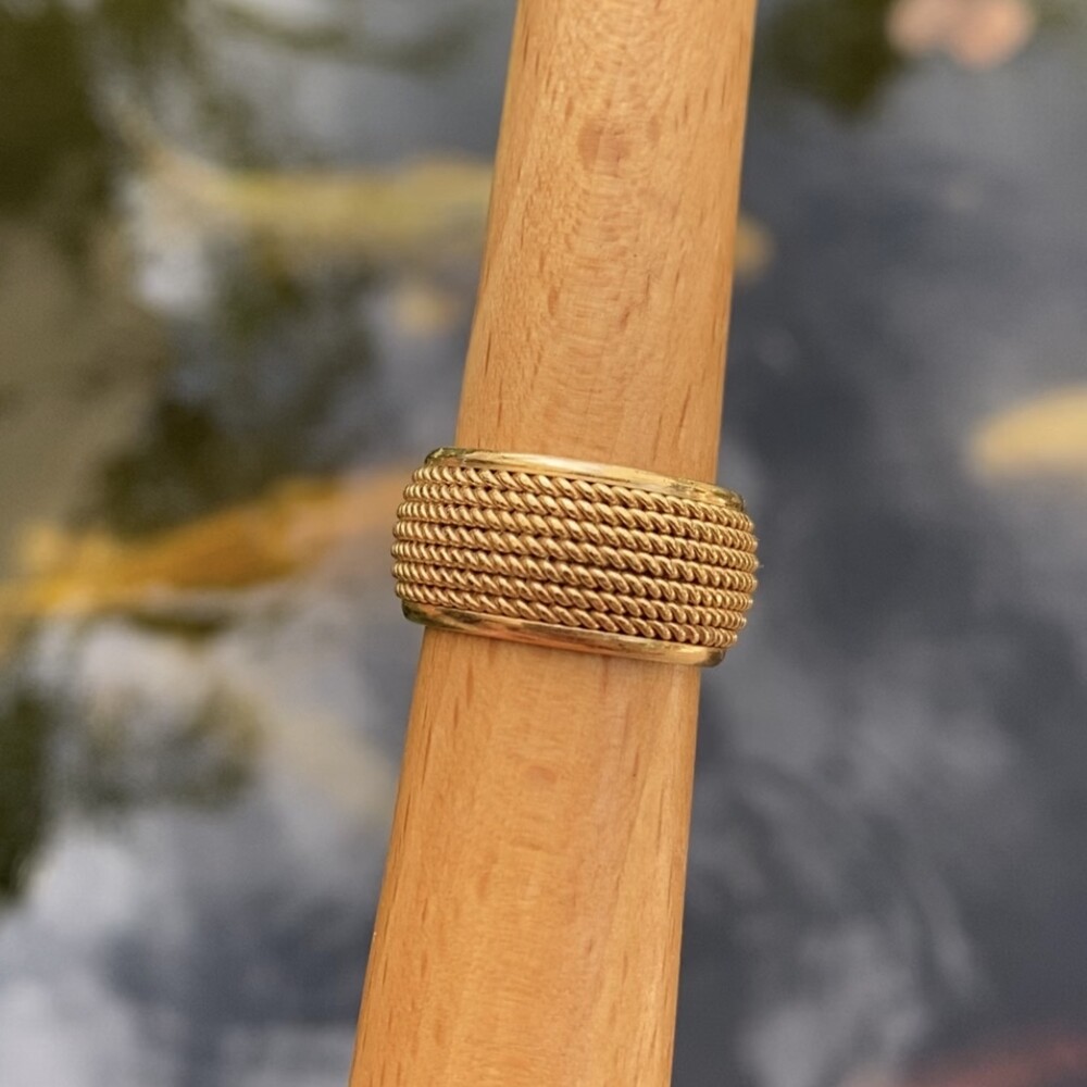 This lovely band ring is 10mm wide and sits 2.5mm off the finger. It is a finger size 5.75 and cannot be sized up, but could take an insert to fit a smaller finger.<div style="position: initial; margin: initial;"><span style="font-size: 16.8px; position: initial; margin: initial;">https://youtu.be/AEb23Da4-wQ</span><br style="position: initial; margin: initial;"></div> 14K Yellow Gold TIFFANY & CO Rope Wrapped Band 12.8g, s5.75