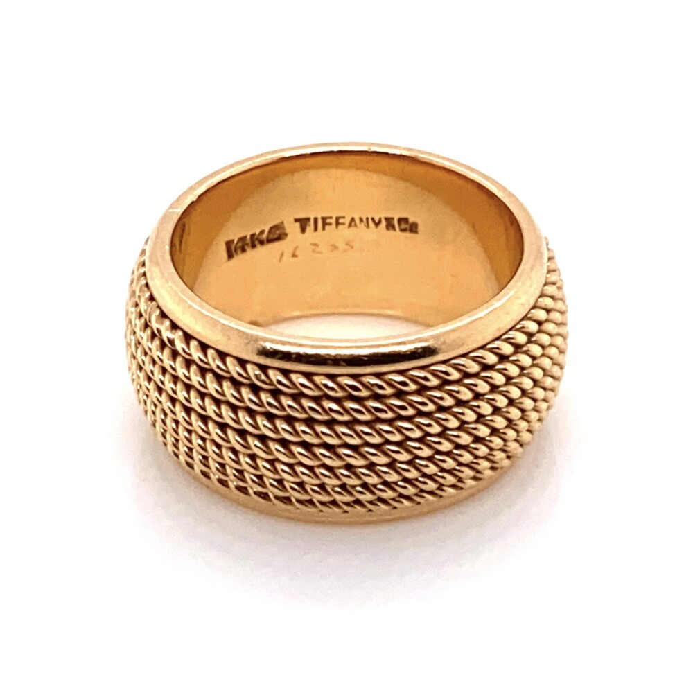 This lovely band ring is 10mm wide and sits 2.5mm off the finger. It is a finger size 5.75 and cannot be sized up, but could take an insert to fit a smaller finger.<div style="position: initial; margin: initial;"><span style="font-size: 16.8px; position: initial; margin: initial;">https://youtu.be/AEb23Da4-wQ</span><br style="position: initial; margin: initial;"></div> 14K Yellow Gold TIFFANY & CO Rope Wrapped Band 12.8g, s5.75