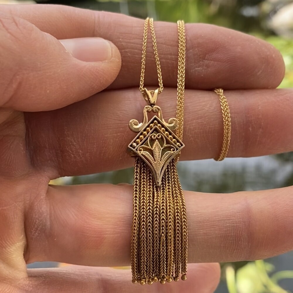 This is a classic & gorgeous Victorian revival necklace with flowing tassels and black enamel detailing. The chain is a newer rolo 14K, 18" length stamped Italy.<div style="position: initial; margin: initial;"><span style="font-size: 16.8px; position: initial; margin: initial;"><a href="https://youtu.be/TQAwEdMoIvo" title="https://youtu.be/TQAwEdMoIvo" style="text-decoration: none;">https://youtu.be/TQAwEdMoIvo</a></span><br style="position: initial; margin: initial;"></div> 14K YG Victorian Revival Tassel Necklace Black Enamel 12.5g, 18" Chain