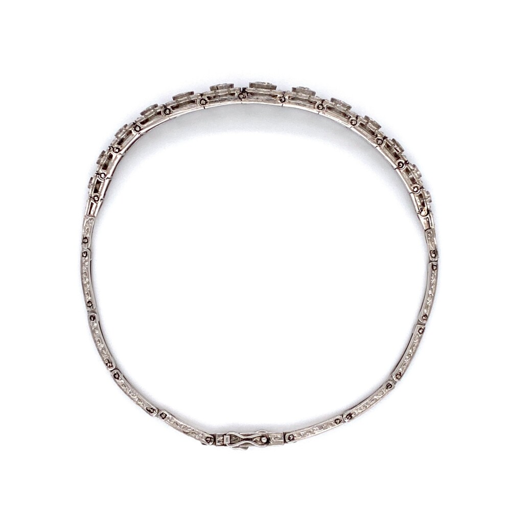 The main diamond section of this gorgeous bracelet is just over 3" long and the rest in handmade platinum link. There are 13 bigger round diamonds weighing approx. 1.10tcw & 68 smaller single/rose cut diamonds weighing approx. .45tcw<div style="position: initial; margin: initial;"><span style="font-size: 16.8px; position: initial; margin: initial;"><a href="https://youtu.be/3TorbDrM6w0" title="https://youtu.be/3TorbDrM6w0" style="text-decoration: none;">https://youtu.be/3TorbDrM6w0</a></span><br style="position: initial; margin: initial;"></div> Platinum Art Deco Graduated FIligree 1.55tcw Diamond Bracelet 16.1g, 7.25"