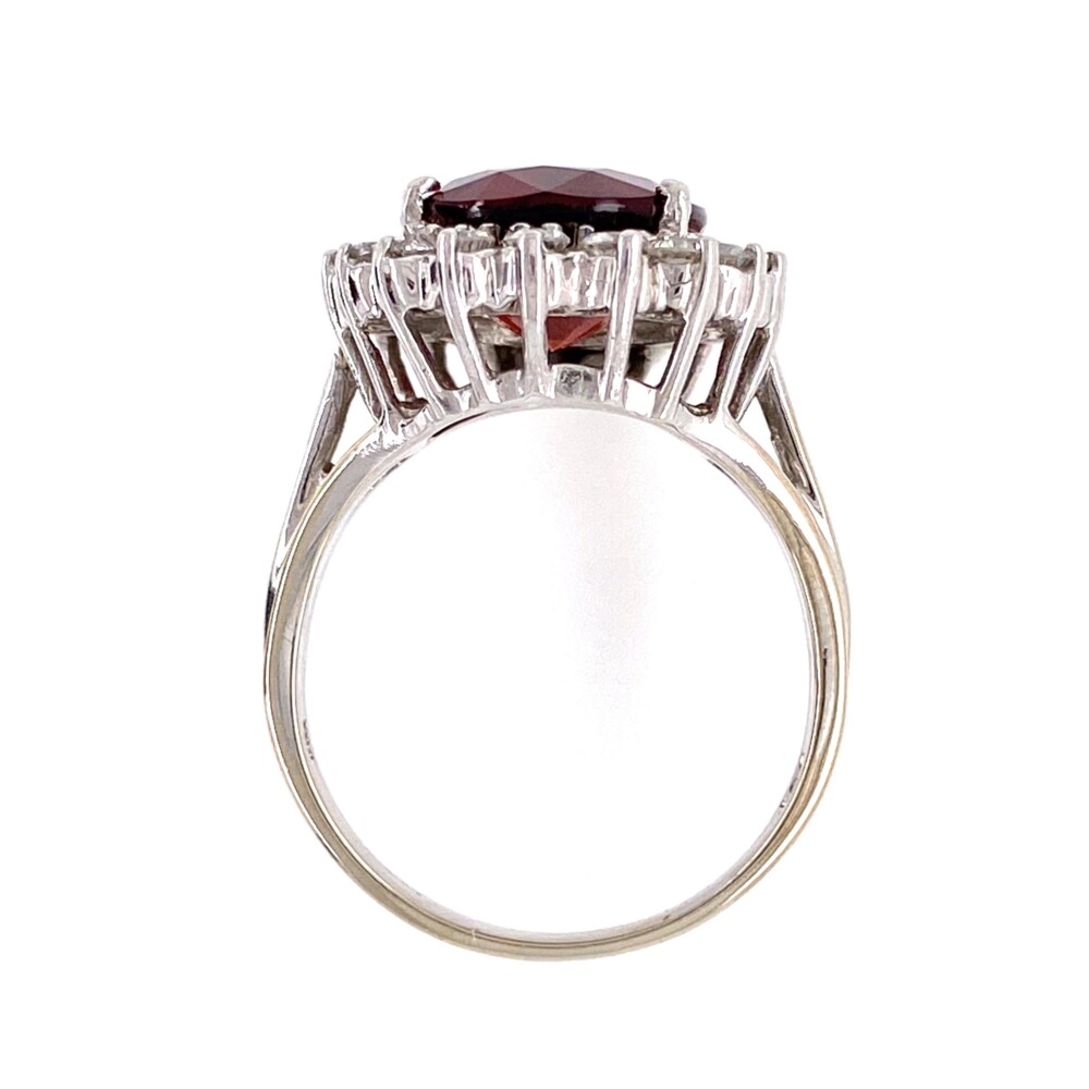 18 round brilliant diamonds are surrounding the center garnet weighing approx. .54tcw<div style="position: initial; margin: initial;"><span style="font-size: 16.8px; position: initial; margin: initial;"><a href="https://youtu.be/Qzliu1Uy1Lk" title="https://youtu.be/Qzliu1Uy1Lk" style="text-decoration: none;">https://youtu.be/Qzliu1Uy1Lk</a></span><br style="position: initial; margin: initial;"></div> 14K WG 7ct Orange Red Garnet & Diamond Ring 6.9g, s7.25