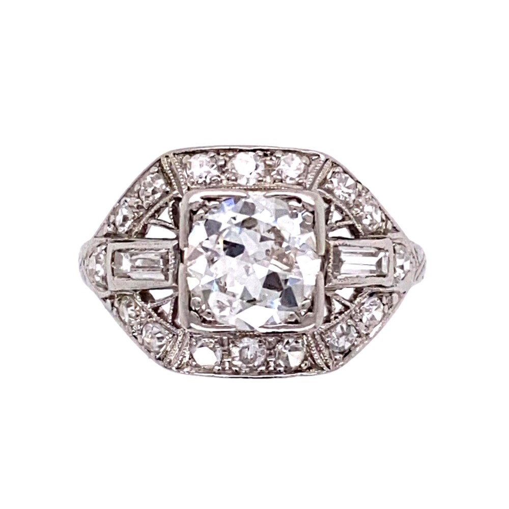 The center old european cut diamond measure 6.32mm and calculates to approx. 1.02ct grading F/G Color, I1 clarity (the inclusions are white and to the side making this stone 100% eye clean). The mounting in handmade in platinum with filigree, engraving, hand blading & set with single cut & baguette diamonds weighing approx. .40tcw<div style="position: initial; margin: initial;"><span style="font-size: 16.8px; position: initial; margin: initial;"><a href="https://youtu.be/lz1mj_Sqy5o" title="https://youtu.be/lz1mj_Sqy5o" style="text-decoration: none;">https://youtu.be/lz1mj_Sqy5o</a></span><br style="position: initial; margin: initial;"></div> Platinum Art Deco 1.42tcw Diamond Engraved, Filigree Ring 3.3g, s5