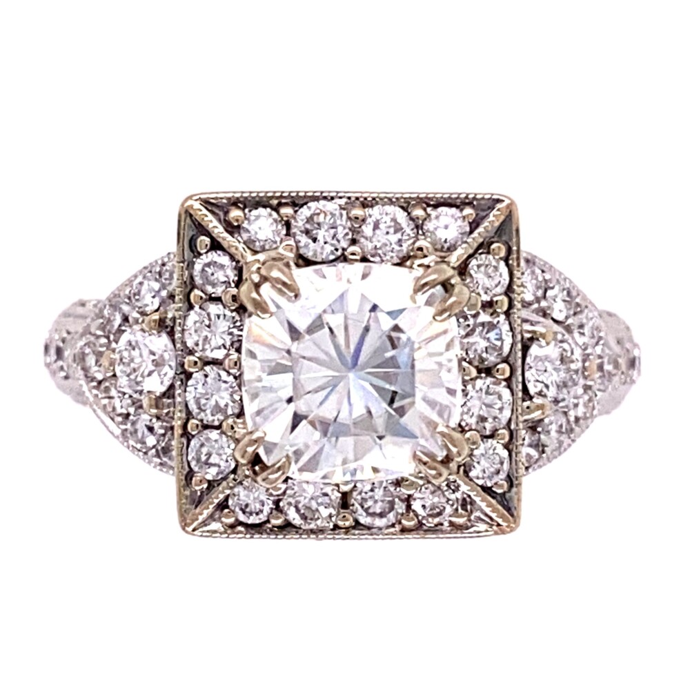 The center is a beautiful approx. 2.00ct fancy cushion cut Moissanite gemstone and the ring has 91 round brilliant diamonds weighing 1.35tcw and is cast constructed very fine. The diamonds are judged F/G color, VS clarity and Moissanite H color, VVS clarity.<div style="position: initial; margin: initial;"><span style="font-size: 16.8px; position: initial; margin: initial;"><a href="https://youtu.be/VPRc6C9vOJE" title="https://youtu.be/VPRc6C9vOJE" style="text-decoration: none;">https://youtu.be/VPRc6C9vOJE</a></span><br style="position: initial; margin: initial;"></div> 18K WG 2ct Cushion Moissanite & 1.35tcw Diamond Ring 6.8g, s6.5