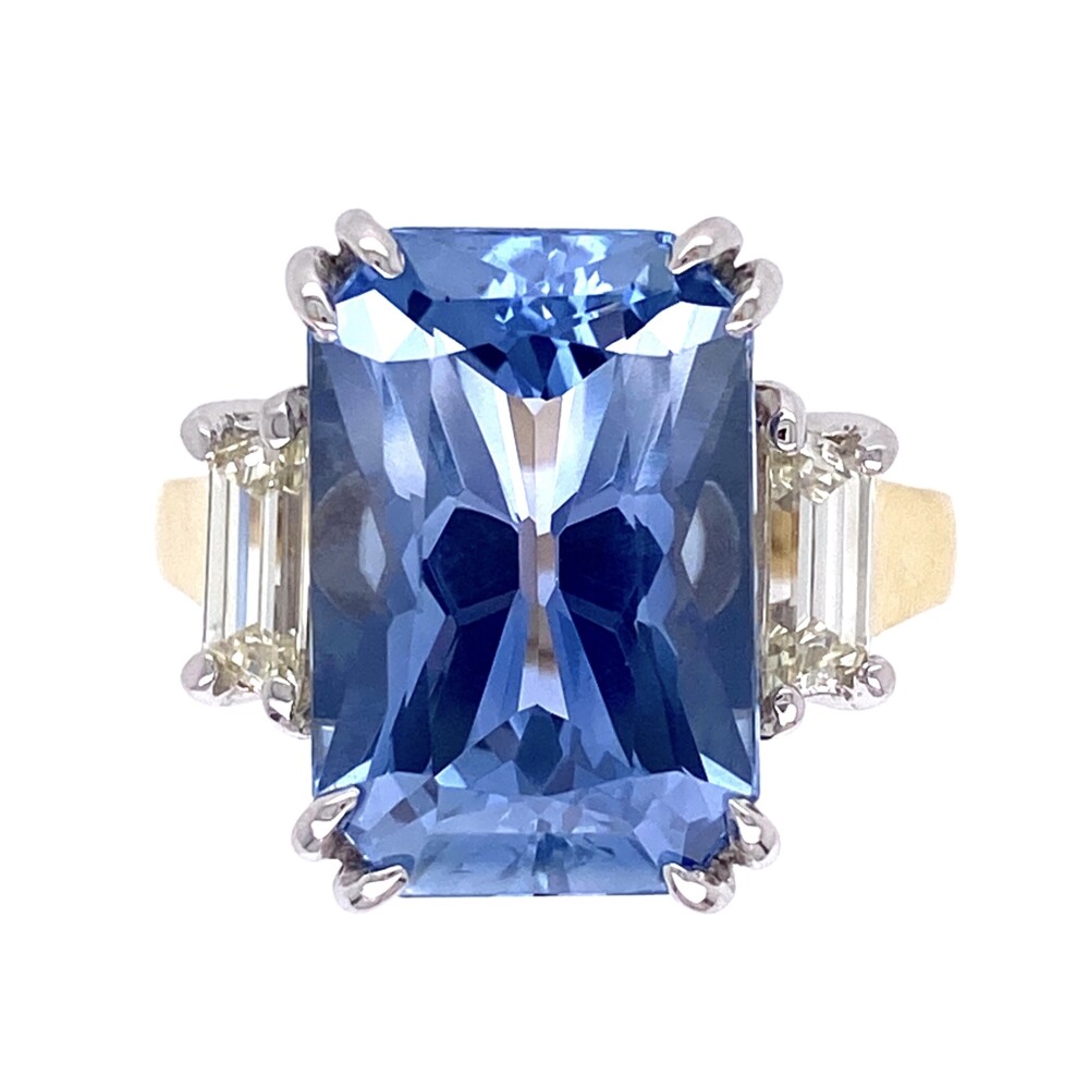 10.23ct Fancy Octagonal Violetish Blue Sapphire GIA#6214109897
2 side step cut trapezoid diamonds are .70tcw. 18K 2tone 10.23ct Octagonal Blue Sapphire Ring GIA#6214109897, .70tcw diamonds 9.5g