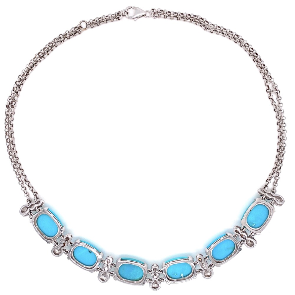 This necklace is super cool and we rarely see large clean matching "robin's egg blue" natural turquoise like this - the color is referred to as sleepy beauty or persian turquoise. There are six matching turquoise stones approx. 60tcw and 21 round brilliant diamonds approx. 1.05tcw. The diamond stations alternate with the turquoise stations and make up about 1/3 of the piece while the rest is a double row 3mm rolo style chain connected with a large lobster clasp. "750" is stamped in a few places. Natural Turquoise & Diamond Collar Necklace in 18K WG 43.8g, 18"