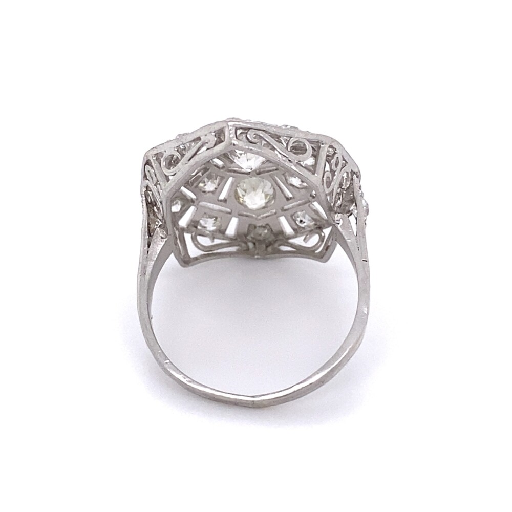Check out this amazing art deco diamond ring from the 1930's using all old european cut round diamonds (there is not one single cut in this ring!). The center old European cut diamond is approx .56ct, two side stones are approx .50tcw and twenty four diamonds are 1.22tcw. The ring is hand bladed with big look, but also light and open - this ring is killer! Platinum Art Deco 2.28tcw Diamond Cluster Ring with Engraving 6.2g, s7