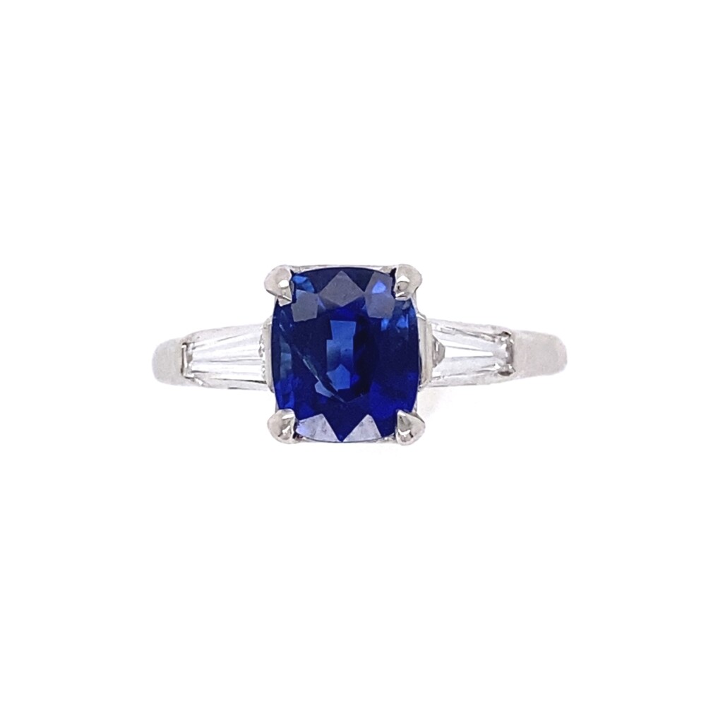Check out this classic 1950's tapered baguette diamond ring with an amazing 1.56ct Cushion Cut Kashmir Natural Sapphire UNHEATED with an AGL & GIA lab reports. <div style="position: initial; margin: initial;">GIA# 6217156669</div><div style="position: initial; margin: initial;">AGL# 1109135 </div><div style="position: initial; margin: initial;">Two tapered baguette diamonds are approx. .40tcw, F color, VS1 clarity judged.</div><div style="position: initial; margin: initial;"><br style="position: initial; margin: initial;"></div> 1.56ct Cushion Cut Kashmir No Heat Natural Sapphire AGL GIA in Platinum .40tcw Diamond Ring