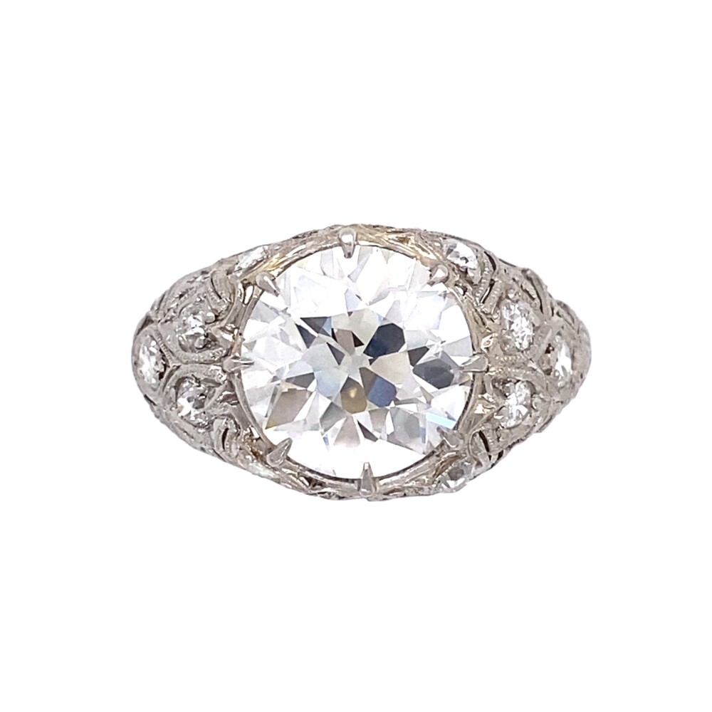 Check out this amazing Old European Cut main diamond weighing 3.07tcw, graded H-VS1 by EGL USA. It is the centerpiece of an amazing handmade platinum ring with prong set old cut diamonds approx. .46tcw, set in geometric shapes so common for the Art Deco era. The ring is still in excellent shape and has another 100 years in her! EGL USA report # US 911357701D<br style="position: initial; margin: initial;"><br> Platinum Art Deco 3.53tcw Diamond Ring with Hand Detailing, s6.75