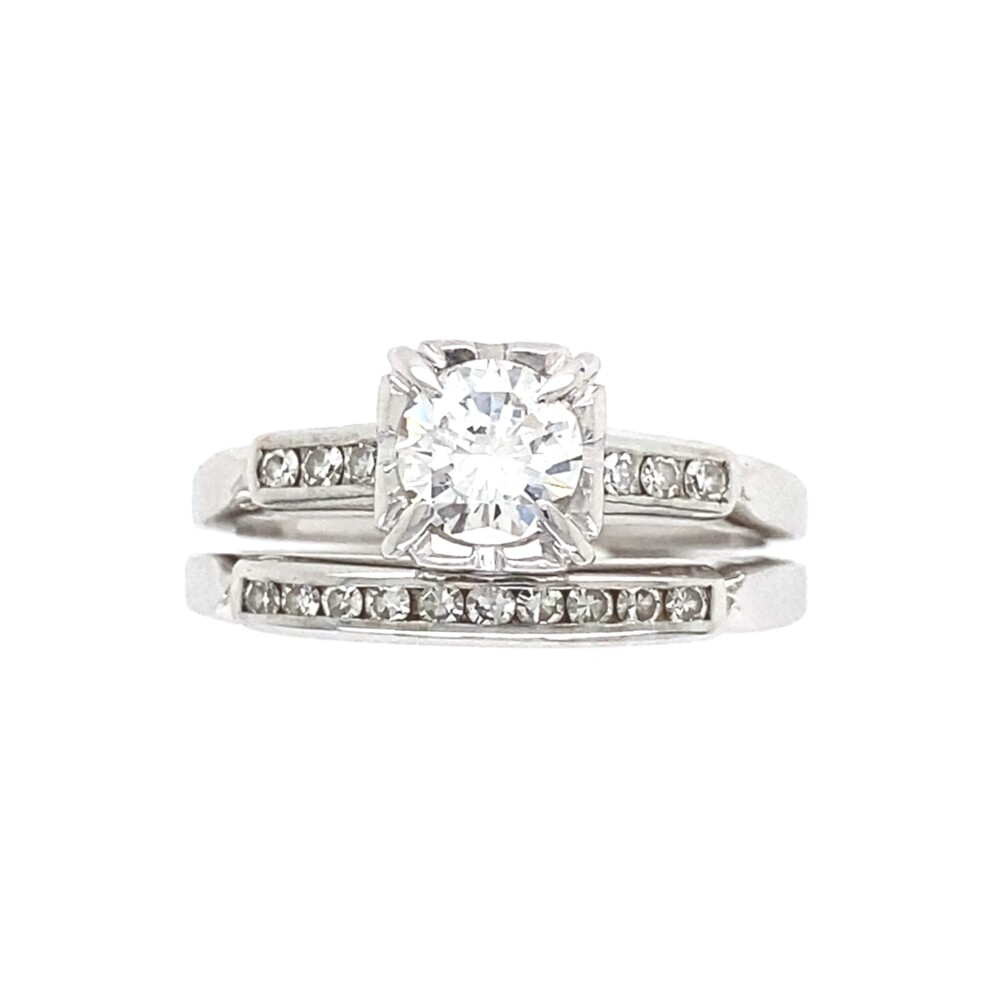 The engagement ring has a center transitional round brilliant diamond approx. .43ct and three single cut diamonds on each side, six total are approx. .06tcw.
The matching band had 10 channel diamonds approx. .05tcw. Wedding Set .54tcw Transitional Diamond Ring & Band 4.15g, s5
