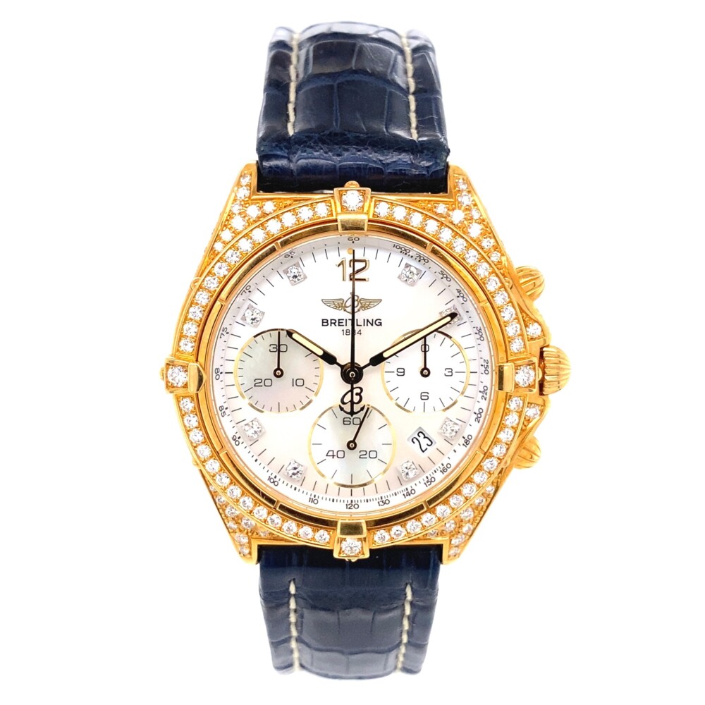 Model Name: Breitling Windrider Sextant 18K Yellow Gold Watch K55046
Model Number: K55046
Serial Number: 312
Movement: Original Breitling quartz movement.
Case: Original Breitling 18K yellow gold all diamond pave case 36.0 mm in diameter with screwed-locked crown and pushers.
Bezel: Original Breitling 18K yellow gold unidirectional rotating diamond bezel. 0-60 elapsed-time. Four 15 minute markers.
Crystal: Original Breitling scratch resistant sapphire crystal.
Dial: Original Breitling mop dial with diamond hour markers, gilt sword hands with luminous inserts, gilt chronograph hand, date aperture at between 4 and 5. Outer minute track.
Bracelet: Tourneau navy blue genuine crocodile strap with 18K yellow gold tang buckle.
Condition: Excellent condition. Mint Breitling Windrider Sextant 18K Yellow Gold Watch K55046 82.6g