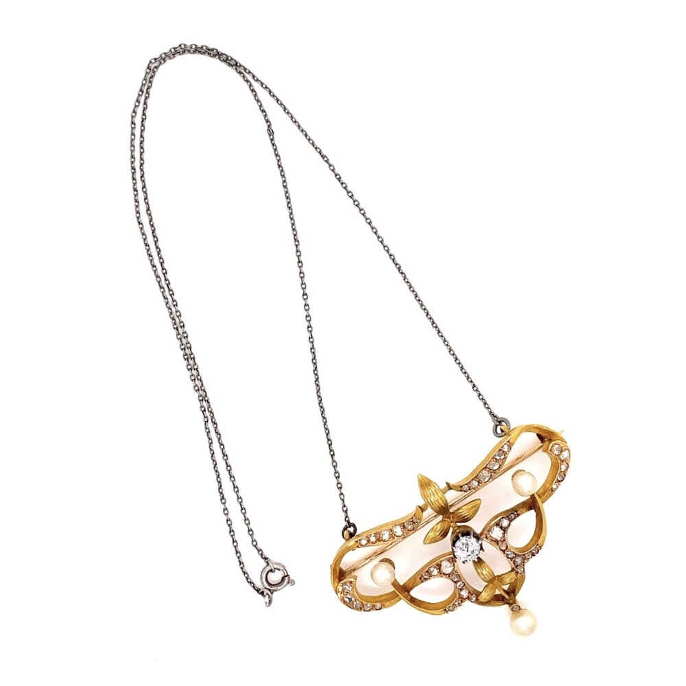 Check out this amazing Victorian Brooch in 20K gold(xrf tested) with a silver chain attached to be worn as a pendant. The center stone is an old European cut diamond approx .35ct, there are 3 pearls 4-5mm and 40 rose cut diamonds approx. 1.00tcw 20K YG Victorian 1.35tcw Diamond & Pearl Brooch Pendant 12.0g, 16" Chain