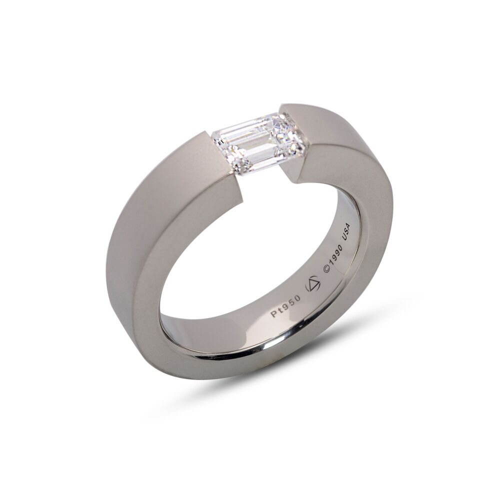 In stock in Platinum model with a CZ. The FS Ring for emerald and radiant cut stones is offered in platinum and 18-karat yellow, rose, or white gold. Finishes include matte or shiny. Center Stone NOT included. All rings are made to order based upon center stone and finger size. Call for details on variations. FS Ring Platinum 5.4 * 5.89 CZ, Size 10.25