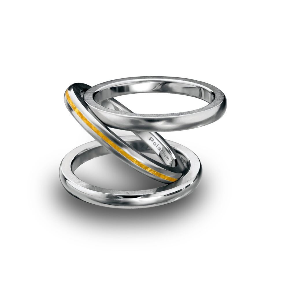 In stock, Pt777, 3 bands: 2 domed in Midnight Blue, and 1 domed in matte with 24k inlay. The Tri-Band is available exclusively in Polarium, our magnetic platinum alloy, and 24K gold inlay is 7.5mm wide. This style comes in domed or flat edges. Engraving on one side are included. Fees apply for additional engravings. Please Inquire for pricing for sizes above a 64. Individual components are available. Tri Band Polarium Domed 2 Midnight Blue Bands and 1 Matte with 24k inlay 7.5 mm